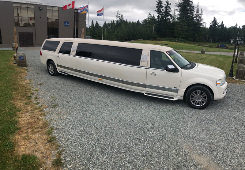 White SUV limousine service Downtown Vancouver